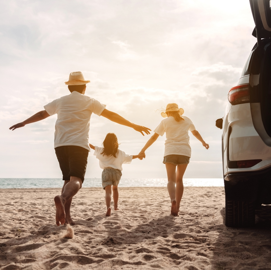 A family next to a Toyota vehicle
